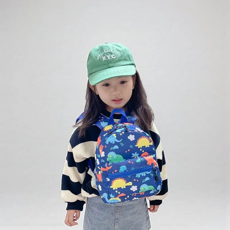 SAC DINO BEBE BLEU FILLE FACE