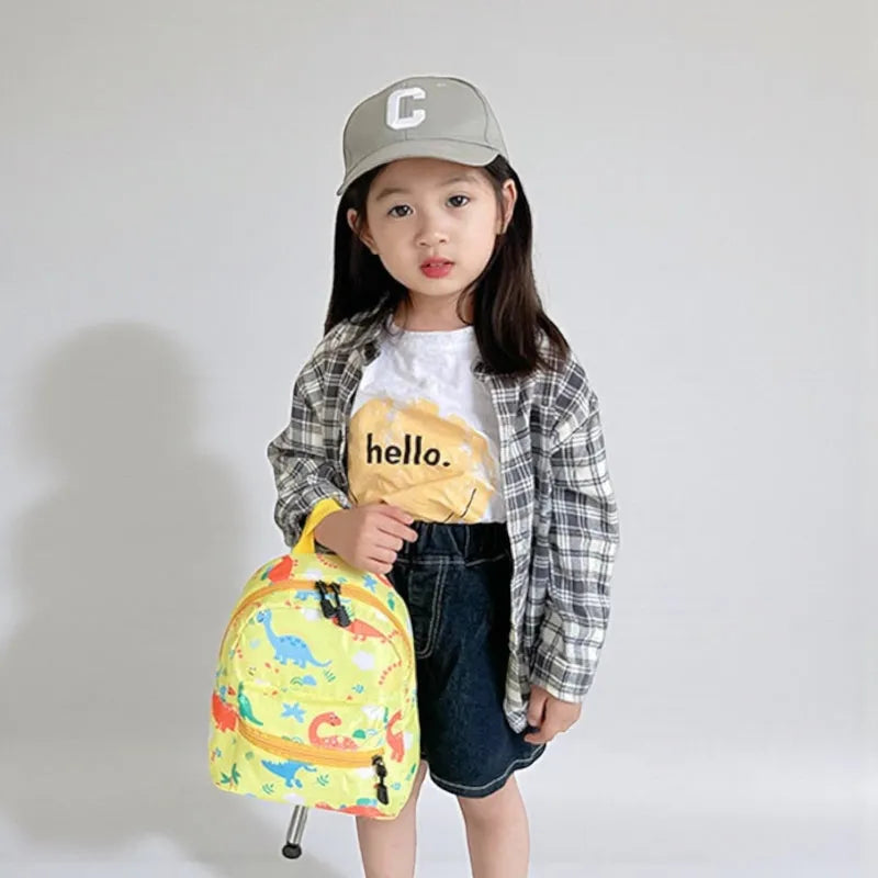 SAC DINO BEBE JAUNE FACE MAIN