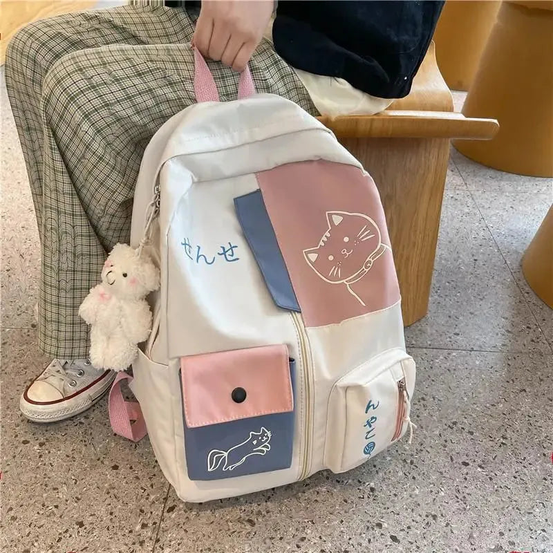 Sac a dos chat rose bleu au  sol