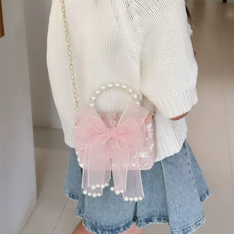 Sac a main enfant fille Rose Perle porté en bandoulière