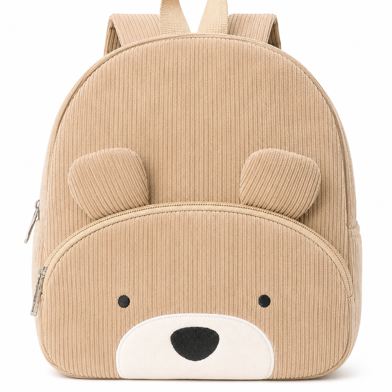 Détail du velours côtelé, des oreilles et du visage brodé du sac à dos enfant ours beige