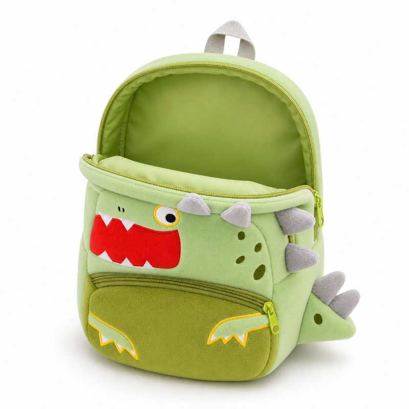 Compartiment principal ouvert et vide du sac à dos maternelle dinosaure vert avec poche avant fermée