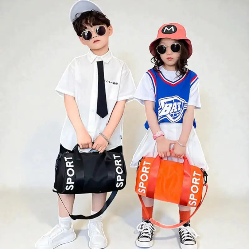 Sac de sport enfant fille Orange Active porté à la main