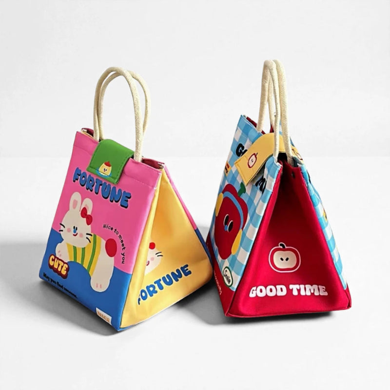 Sac isotherme repas enfant Lapin Rose vu de côté, structure triangulaire et poignées coton
