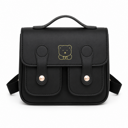 Sac maternelle enfant noir avec deux poches avant, attaches dorées et motif ours, vue de face