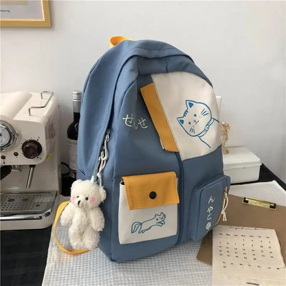 sac a dos bleu chat sur bureau
