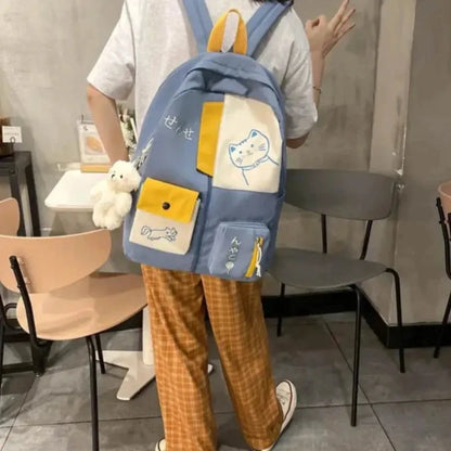 sac a dos bleu chat fille pose de dos