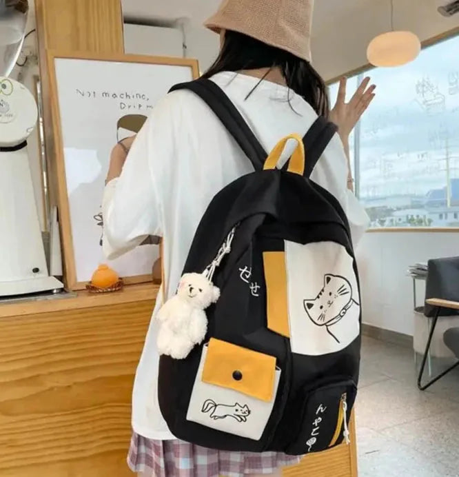 sac a dos chat noir ecoliere pose