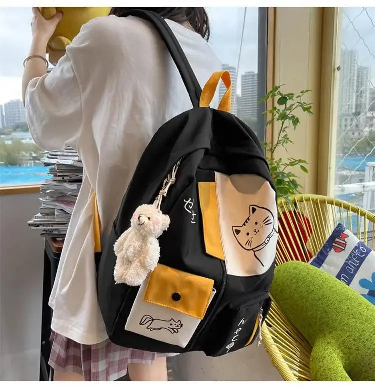 sac a dos chat noir sur écolière dos