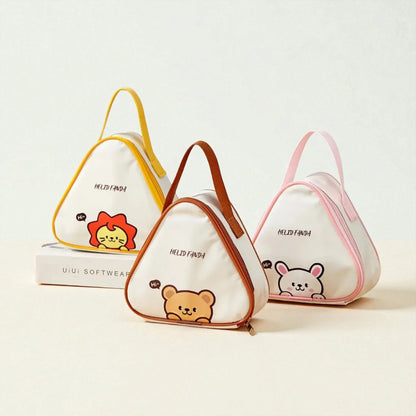 Trois sacs gouter enfants avec motifs animaux : lion, ours et lapin, posés sur une table.