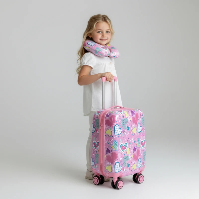 Valise enfant fille 10 ans rose à roulettes, portée par une enfant, motif cœurs et format cabine
